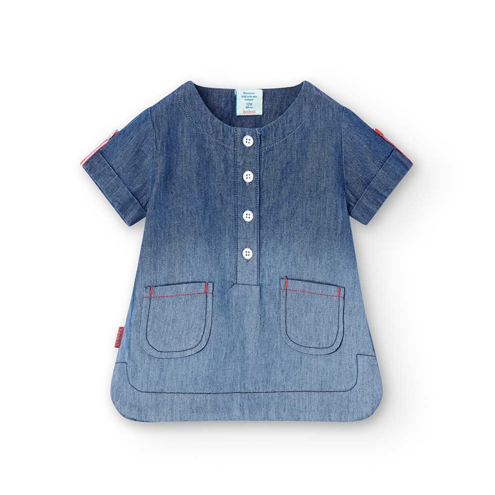 Denim blouse from the Boboli Girls' Clothing Line, with red buttons and pockets on the front.
 

...