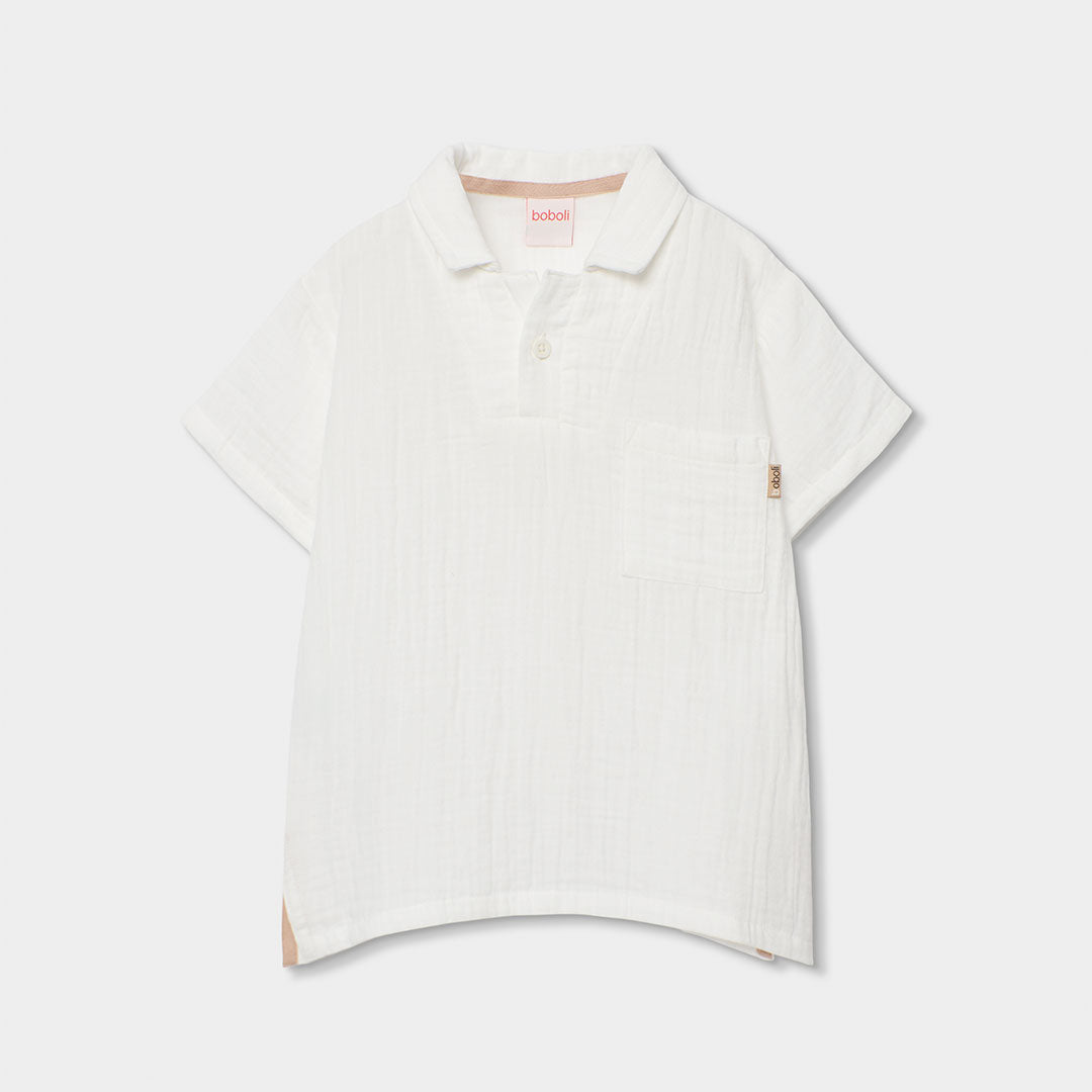 Polo from the Children's Clothing Line Boboli, made of slub cotton, with a two-button opening and...