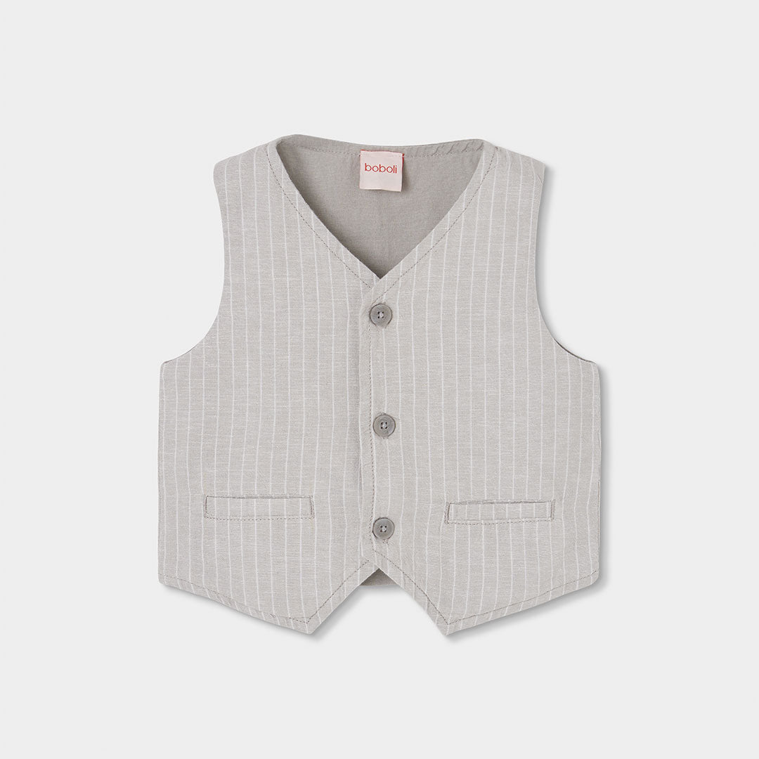 Gilet en lin de la Ligne Vêtements Enfant Boboli, avec devant à rayures et dos uni.
Composizione:...