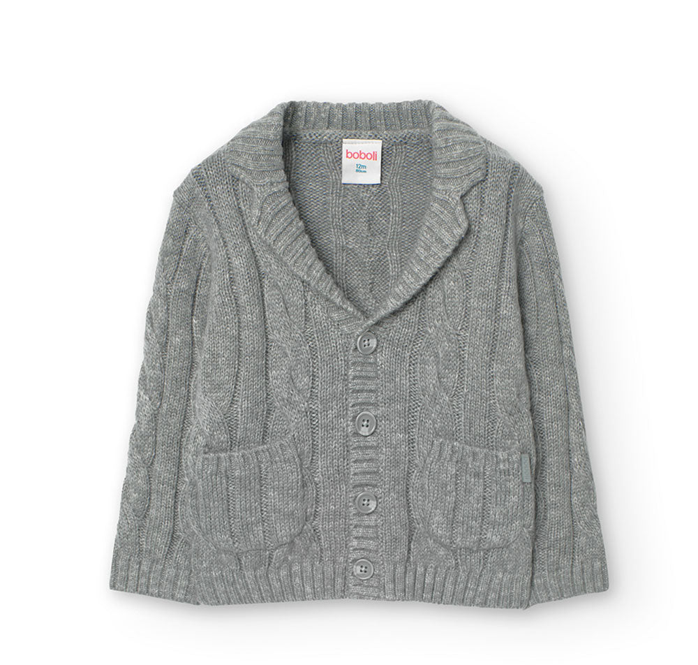 Cardigan doux de la Ligne Vêtements Enfant Boboli, avec un tricot torsadé et un col châle. 
Compo...