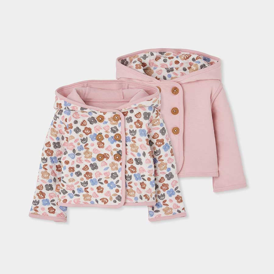 Enveloppez votre petite fille dans cette veste réversible qui allie avec douceur praticité et sty...