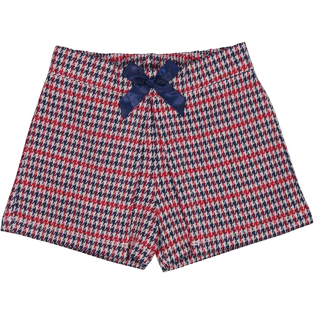 Shorts from the Birba Girls' Clothing Line in blue and red houndstooth, with a bow on the front a...