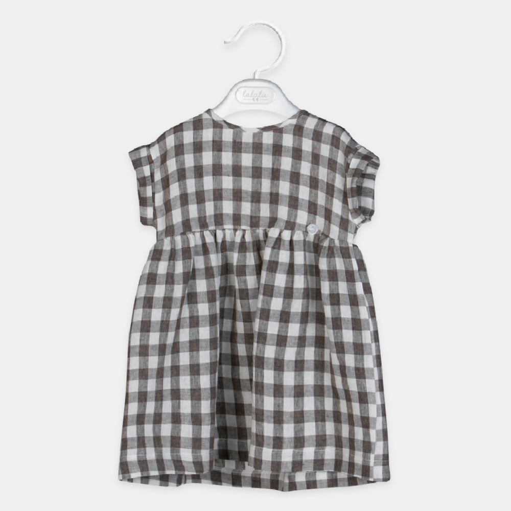 Robe en lin de la Ligne Vêtements Fille Lalalù, avec motif à carreaux et coupe ample.
Composition...