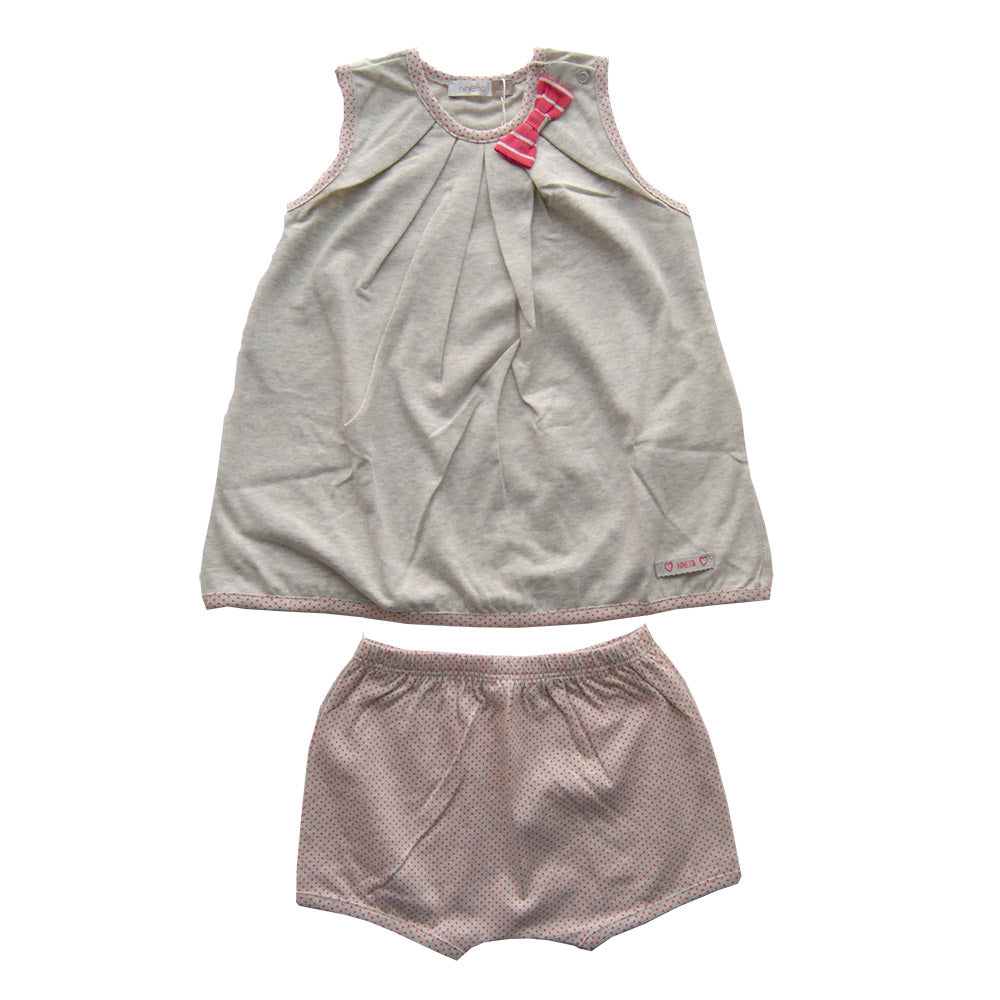 Scamiciato de la ligne vêtements fille Ninetta. Uni avec finitions à pois. Petit nœud rayé sur le...