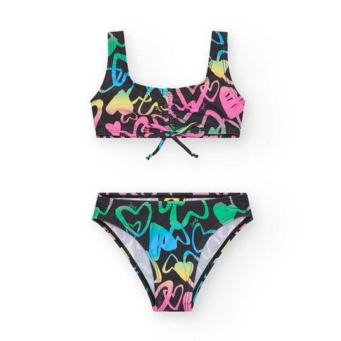 Costume da bagno per bambina con design colorato e accattivante.