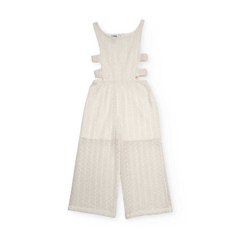 Tuta bianca per bambina con tagli laterali e design elegante.