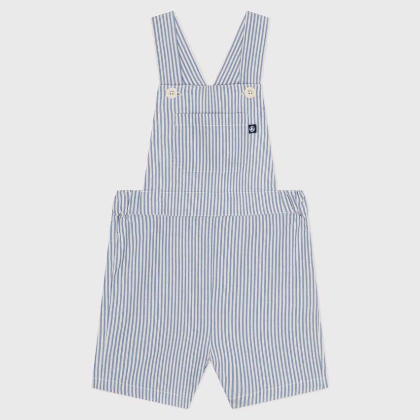 
Short dungarees from the Petit Bateau children's clothing line in seersucker;
patch pocket on th...