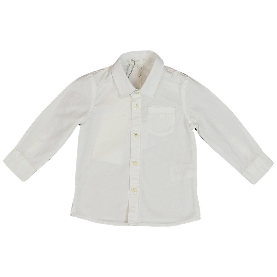 Chemise de la ligne vêtements enfant Silvian Heach Kids, avec une poche sur le devant.
Compositio...