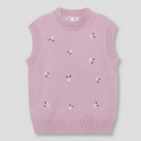 Gilet rosa chiaro senza maniche con piccoli fiori ricamati bianchi e verdi