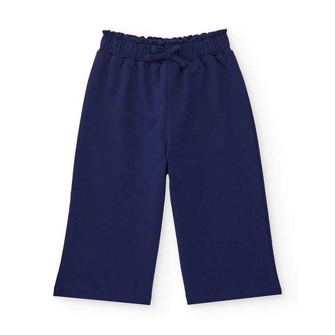 Pantaloni felpa blu con vita elastica per bambina.