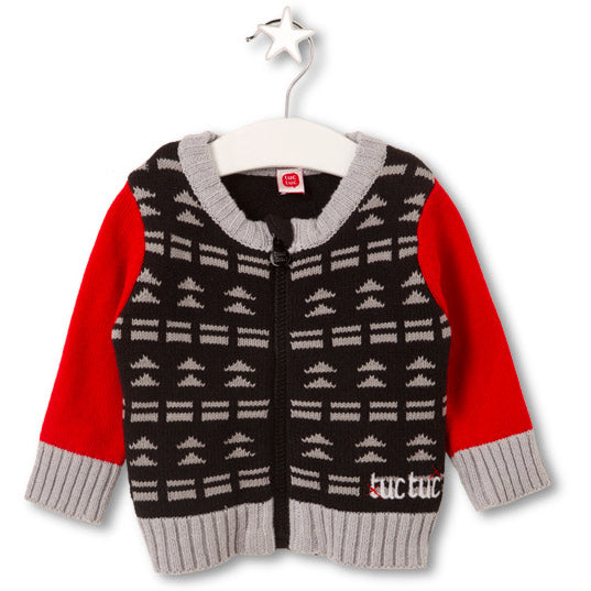 Cardigan de la ligne vêtements enfant Tuc Tuc. Sur le devant, motif géométrique.
Manches en contr...