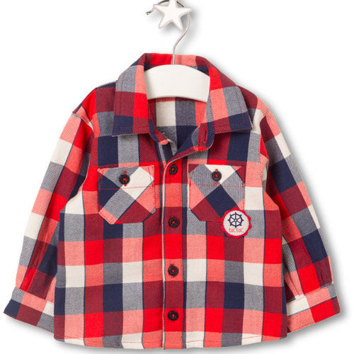 Chemise de la ligne de vêtements pour enfants Tuc Tuc à carreaux avec petites poches à l'avant.

...