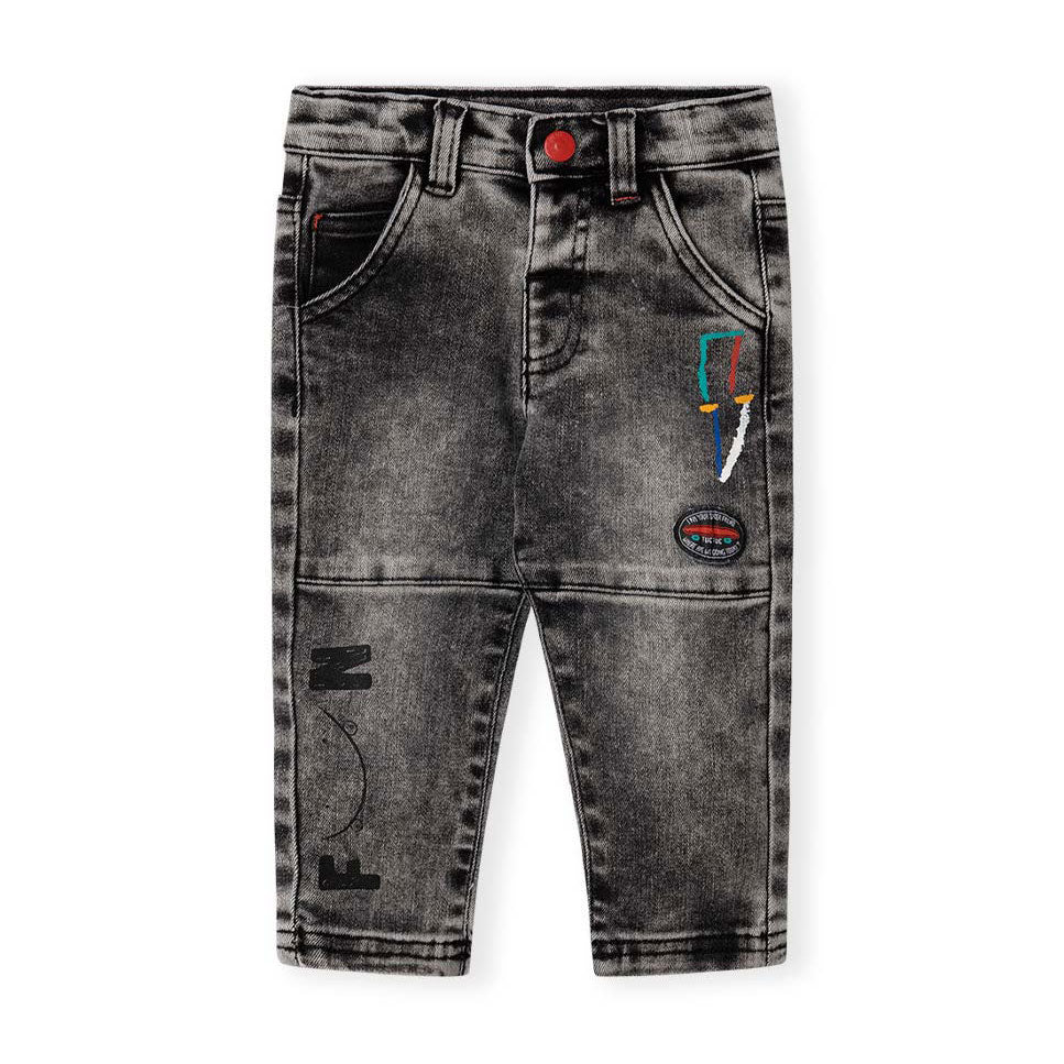 Jeans noirs de la Ligne Vêtements Fille Tuc Tuc, avec de petites impressions colorées à l'avant.
...