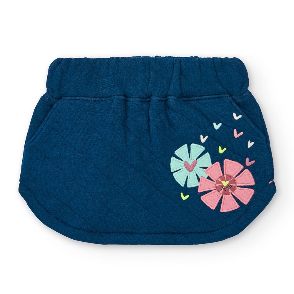 Minijupe de la Ligne Vêtements Fille Tuc Tuc, matelassée avec une fleur appliquée sur un côté. 
C...