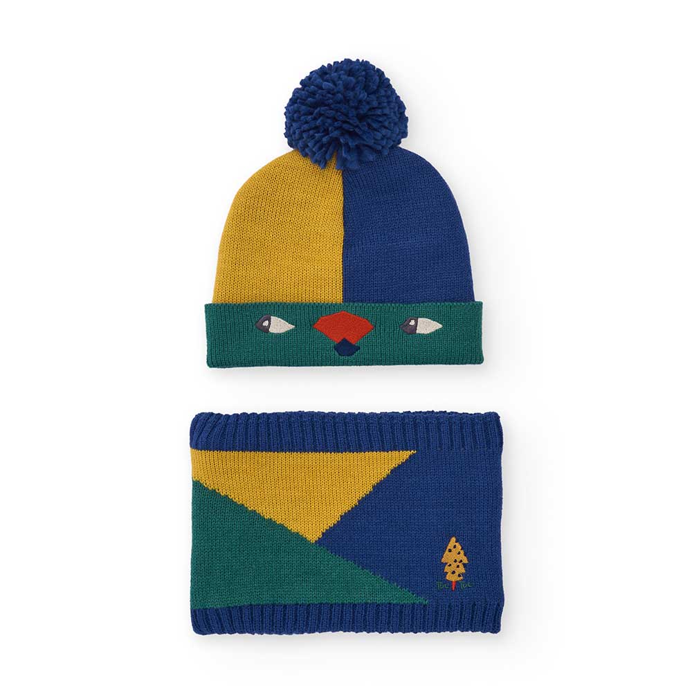 Set de la Ligne Vêtements Enfant Tuc Tuc, composé d'un bonnet avec pompon et yeux brodés ainsi qu...