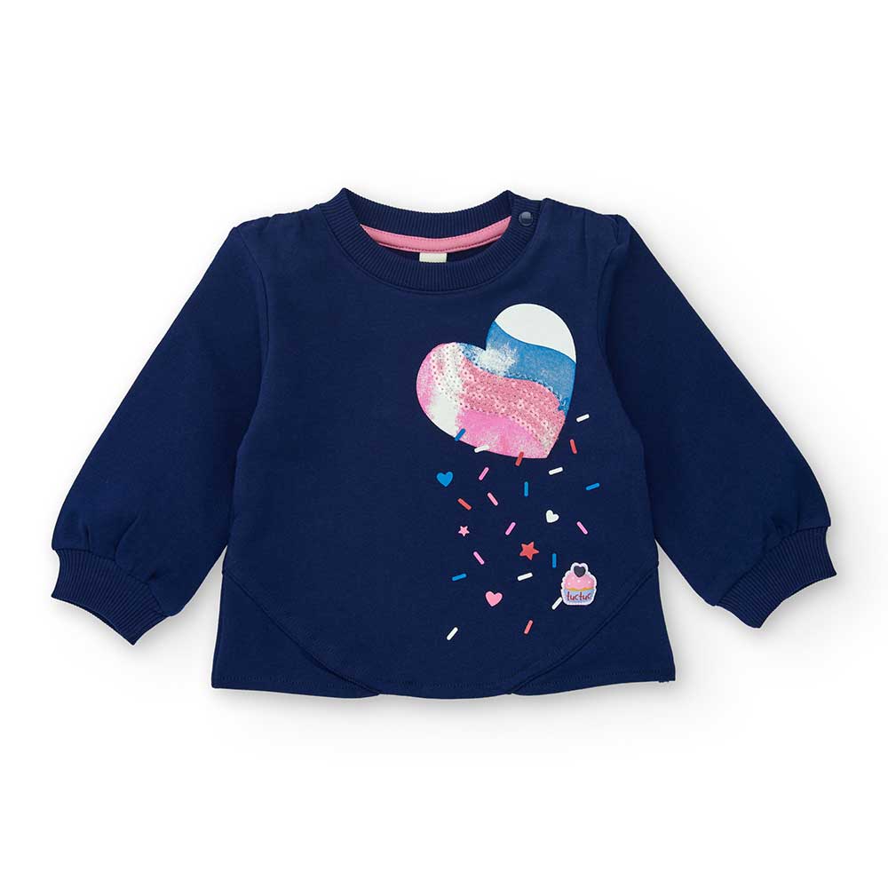 Sweatshirt from the Tuc Tuc Children's Clothing Line, with an applied heart on the front.
Composi...