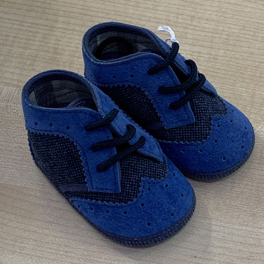 
  Shoes from the Ambarabà children's clothing line, in very soft materials and
  with craftsmans...