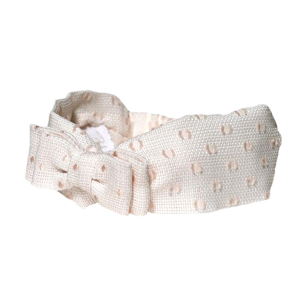 
  Soft
  headband for baby girl in white or pink plumetì fabric with ton sur ton polka dot relie...