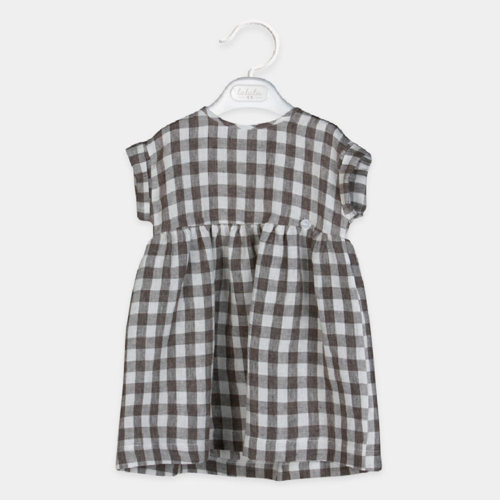 
Linen dress from the Lalalù Girl's Clothing Line, with checkered pattern and wide cut.

Composit...