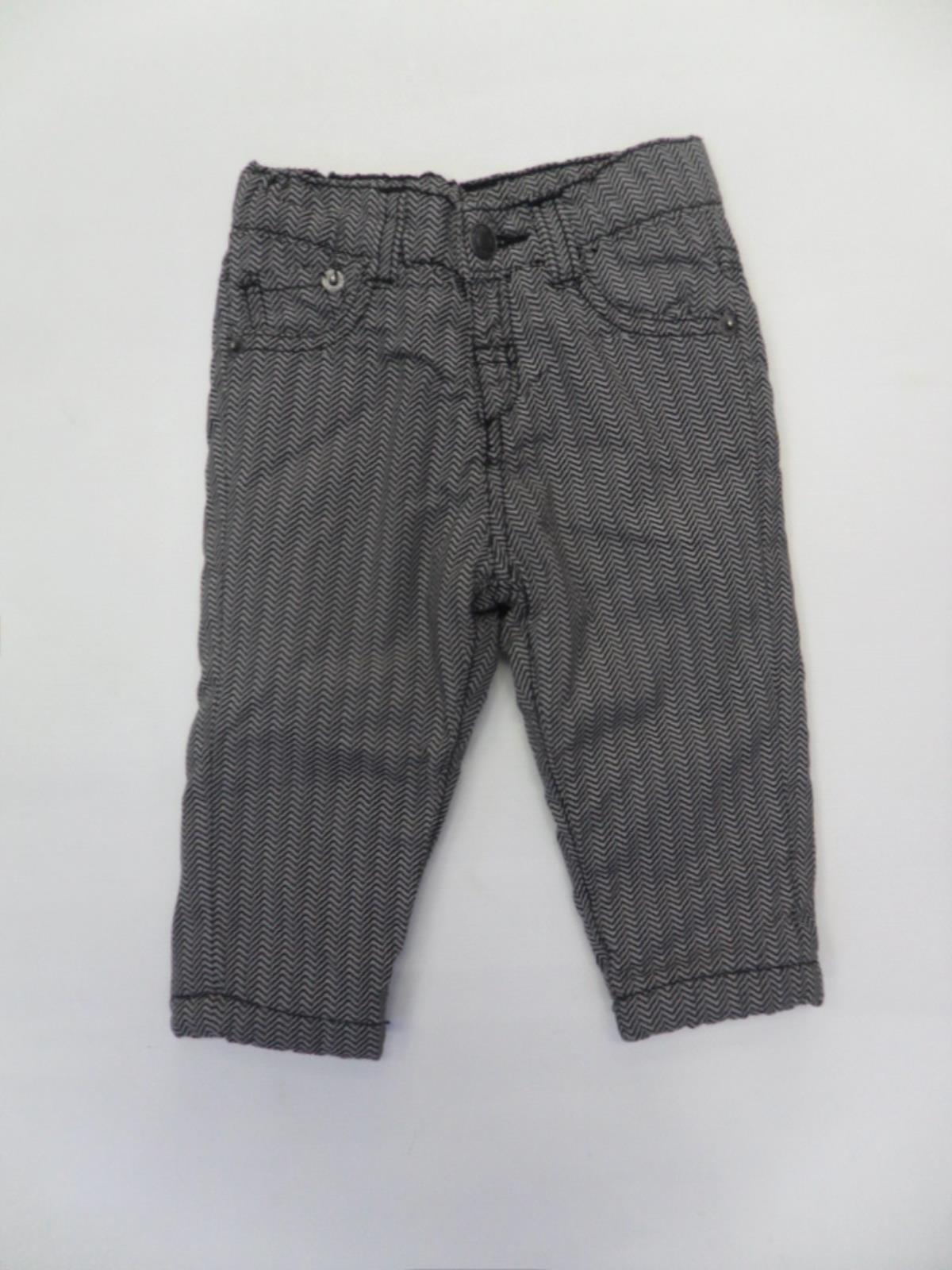 
  Trousers from the Tuc Tuc children's clothing line in technical herringbone fabric.
  Five poc...